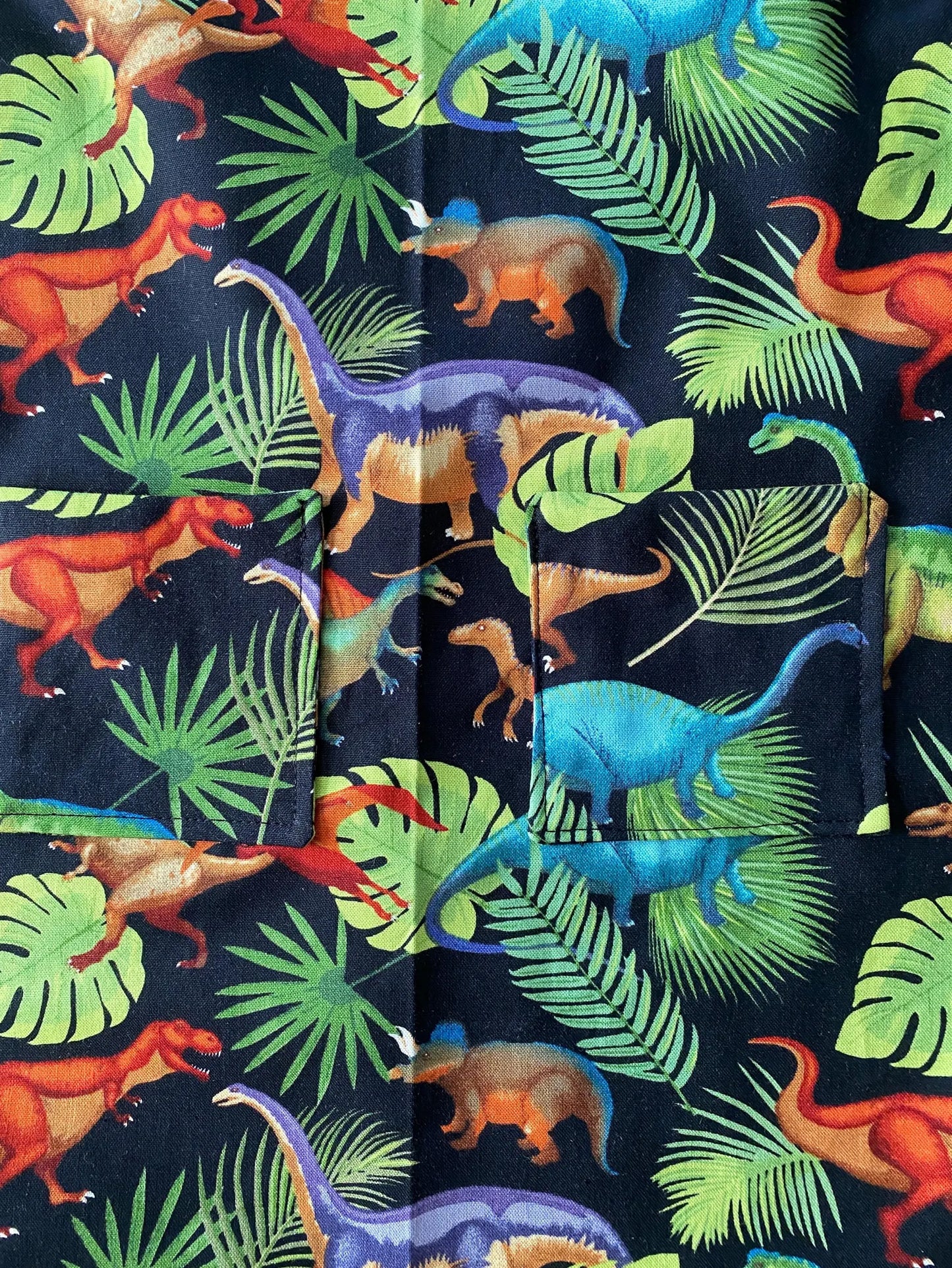 Reversible Child Apron with Pockets Featuring Dinosaurs