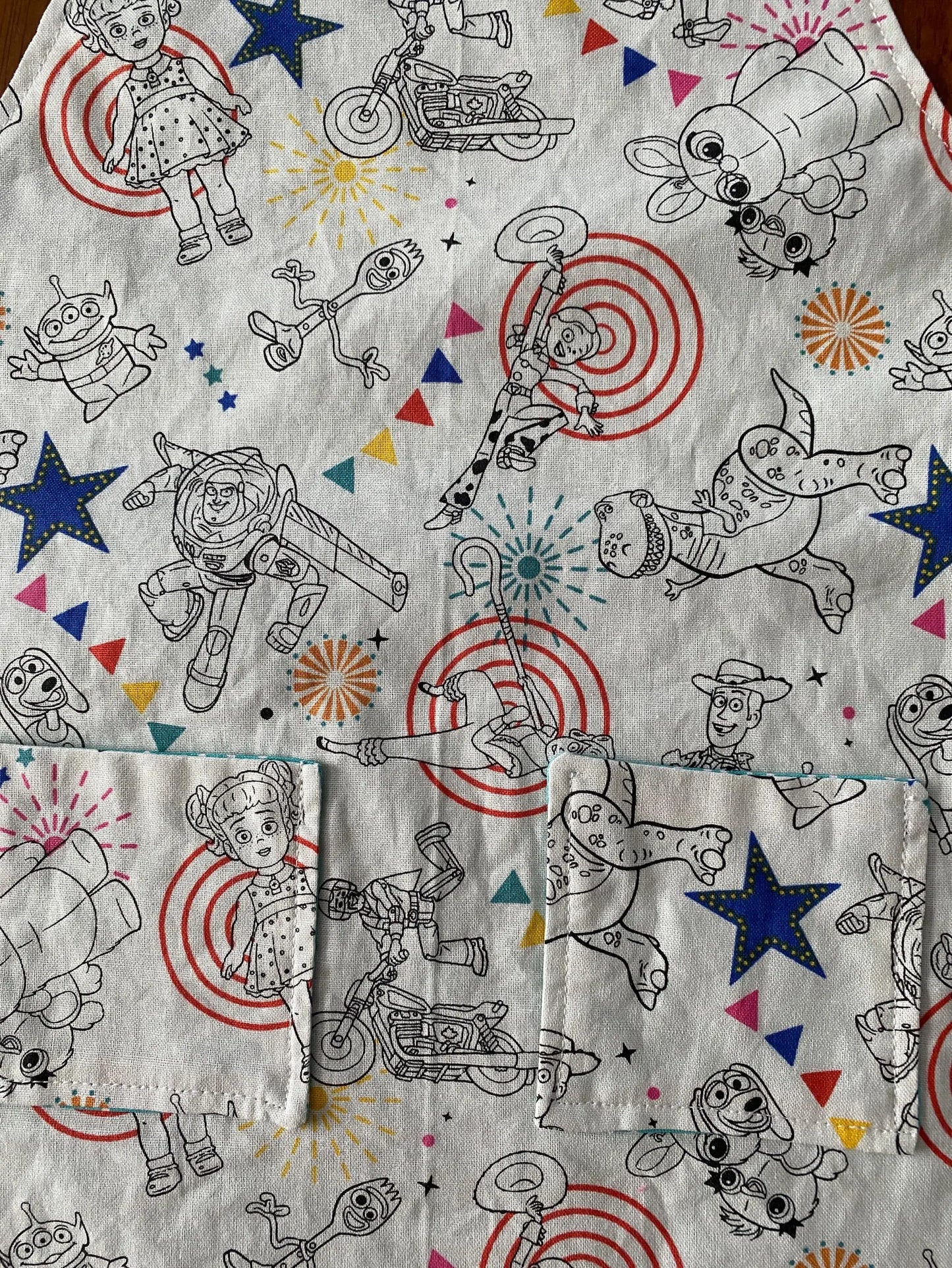 Reversible Child Apron with Pockets Featuring Toy Story