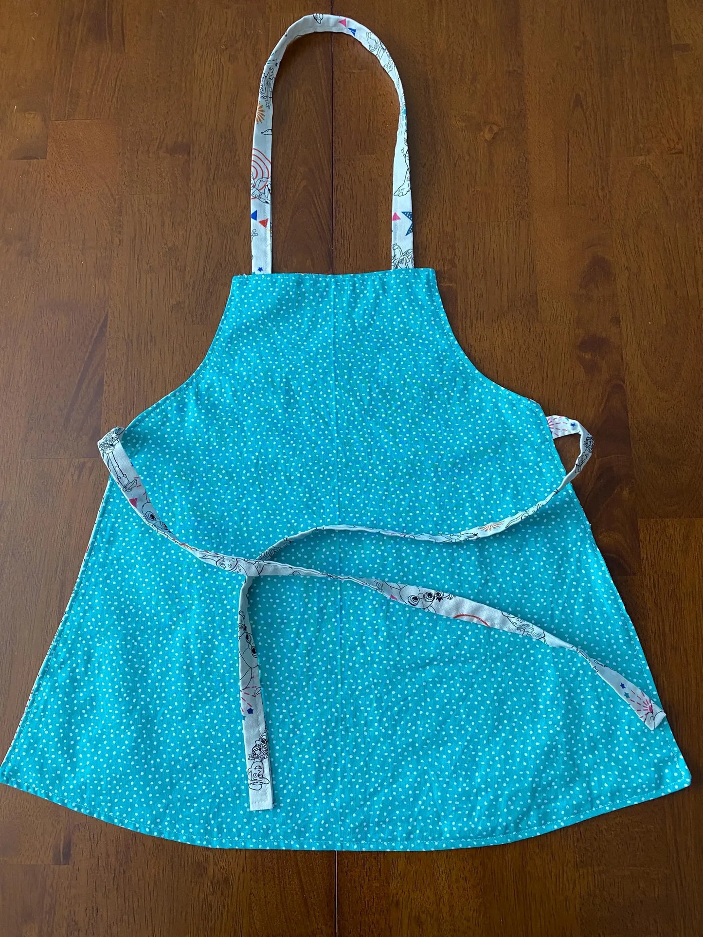 Reversible Child Apron with Pockets Featuring Toy Story