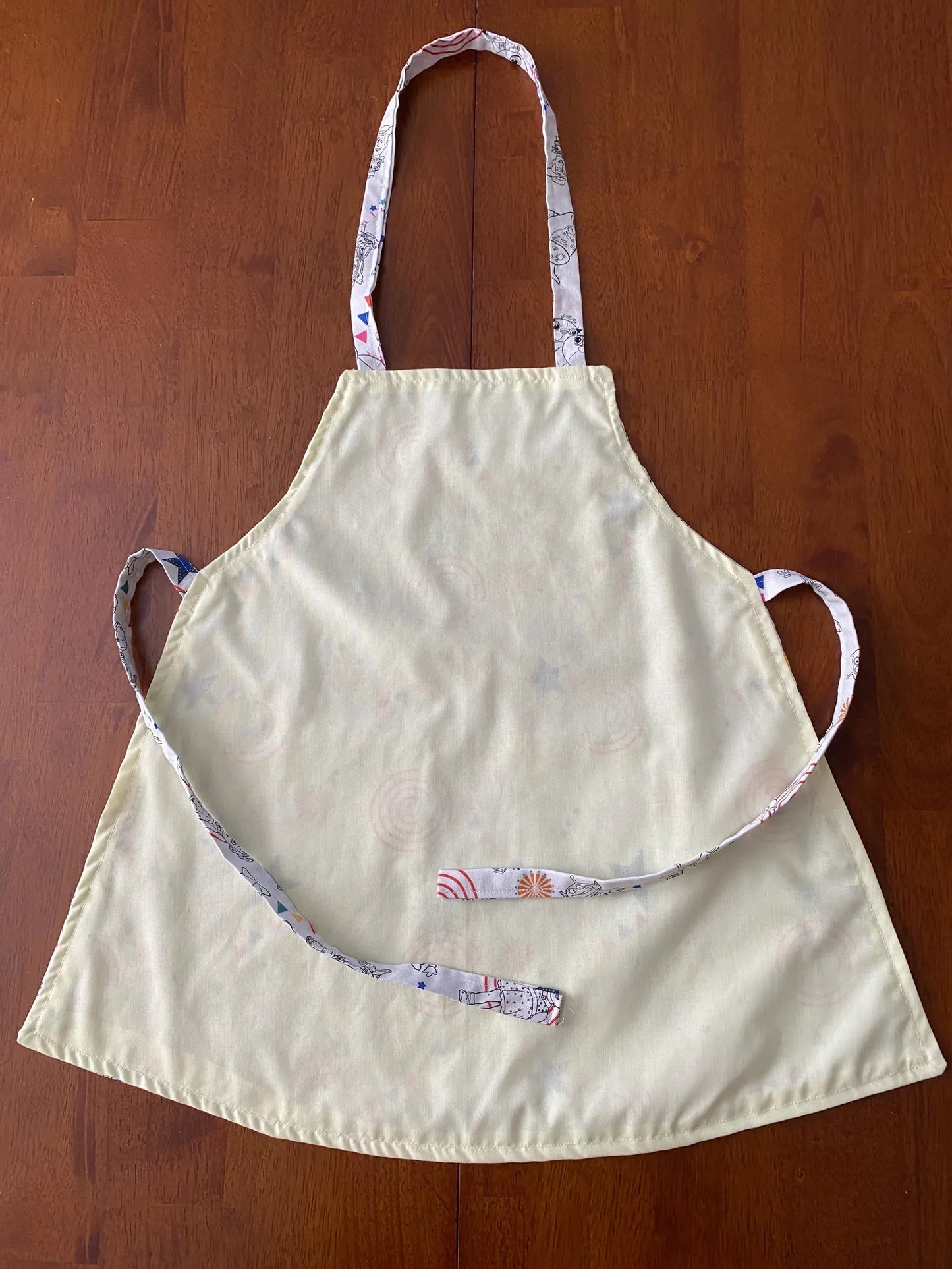 Reversible Child Apron with Pockets Featuring Toy Story